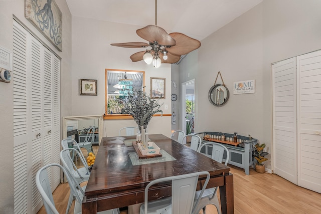 dining area with ceiling fan and light hardwood / wood-style floors