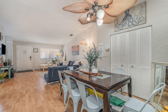 dining room with ceiling fan and light hardwood / wood-style floors