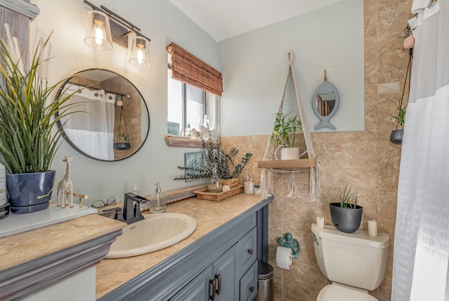 bathroom featuring oversized vanity, tile walls, and toilet