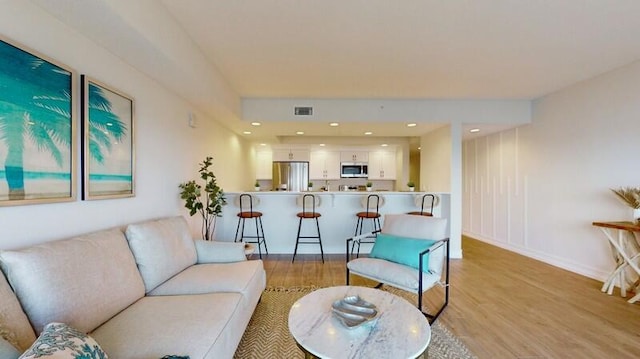 living room featuring light wood-type flooring