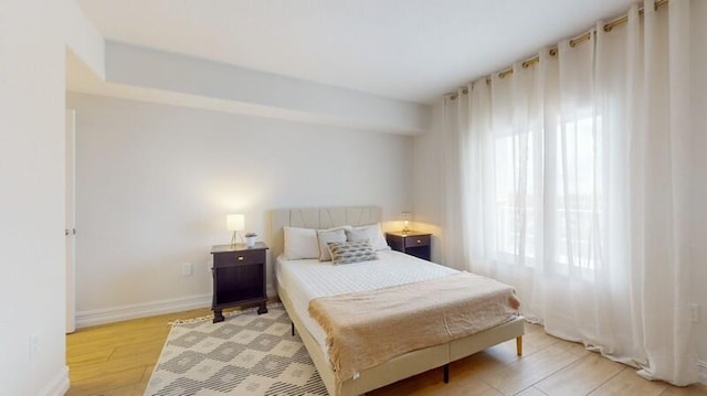 bedroom with light wood-type flooring