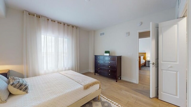 bedroom with light hardwood / wood-style flooring