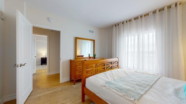 bedroom featuring light hardwood / wood-style floors