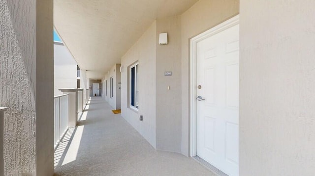 hall featuring carpet floors