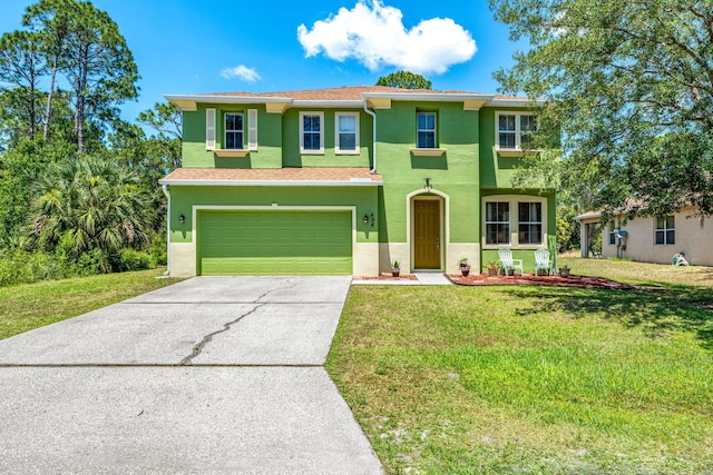 view of front of property featuring a front lawn and a garage