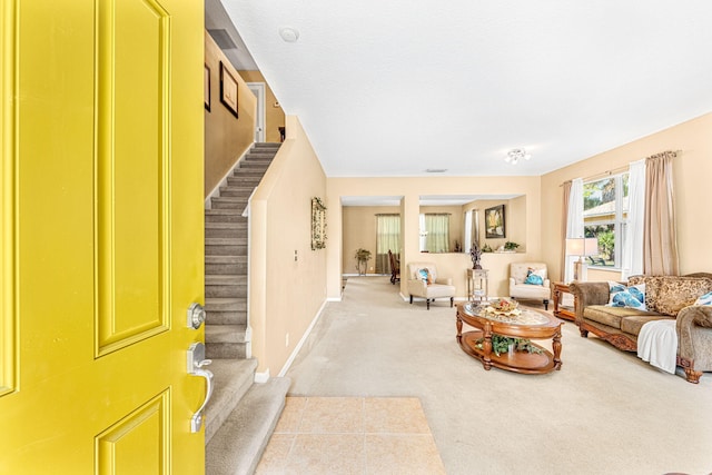 carpeted living room featuring a textured ceiling