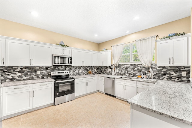 kitchen featuring white cabinets and stainless steel appliances