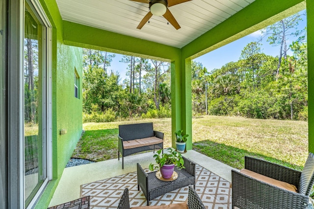 sunroom / solarium featuring ceiling fan and a healthy amount of sunlight