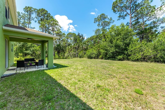 view of yard featuring an outdoor hangout area and a patio area