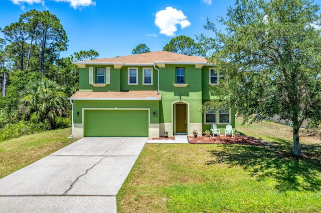 view of front of home featuring a front yard and a garage