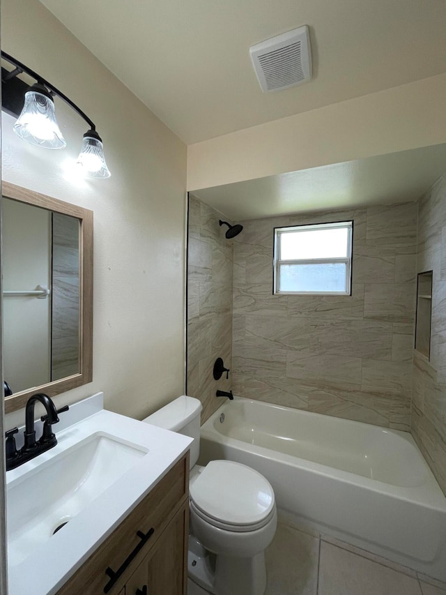 full bathroom with toilet, tile patterned flooring, tiled shower / bath combo, and vanity