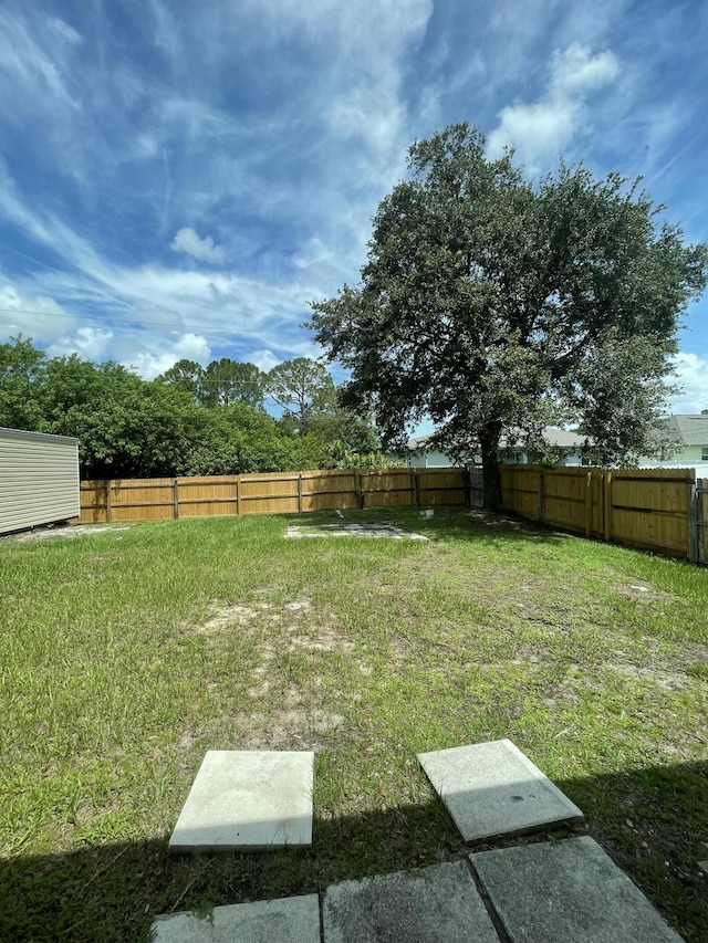 view of yard featuring a fenced backyard