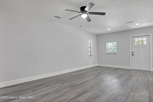 702 S Myrtle Ave, New Smyrna Beach, FL 32168 - interior space featuring baseboards, visible vents, and wood finished floors