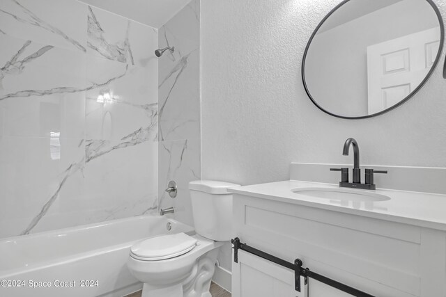 702 S Myrtle Ave, New Smyrna Beach, FL 32168 - full bathroom with toilet, vanity, a textured wall, and shower / tub combination