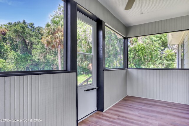 702 S Myrtle Ave, New Smyrna Beach, FL 32168 - unfurnished sunroom with ceiling fan