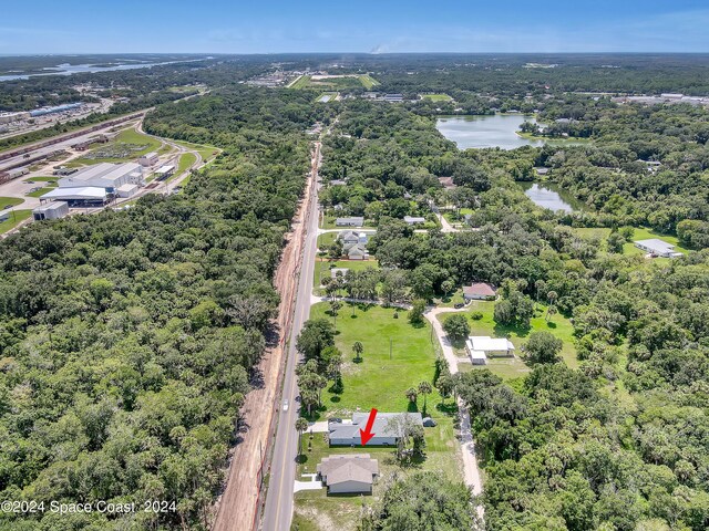 702 S Myrtle Ave, New Smyrna Beach, FL 32168 - drone / aerial view featuring a water view
