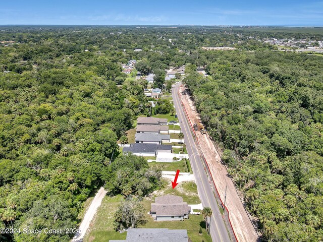 702 S Myrtle Ave, New Smyrna Beach, FL 32168 - drone / aerial view with a view of trees