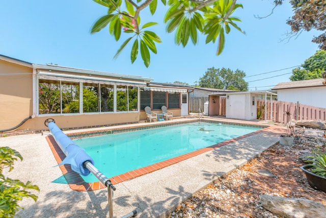 view of swimming pool featuring a patio area