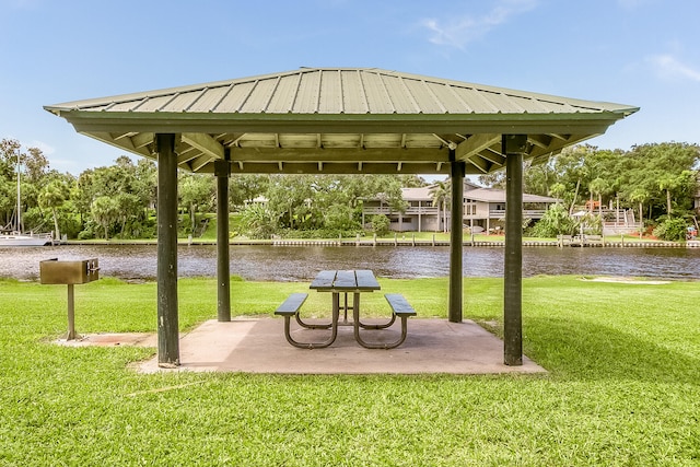 view of home's community featuring a lawn, a water view, and a gazebo