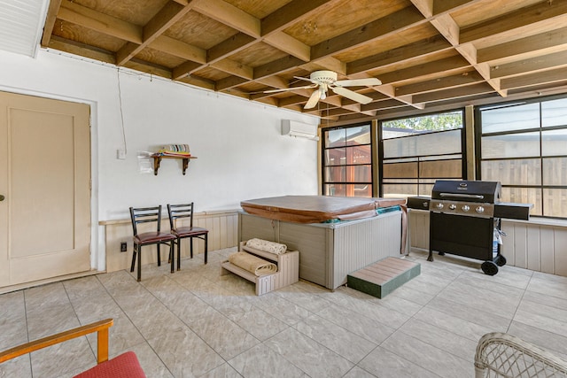 sunroom with wood ceiling, ceiling fan, and a wall mounted air conditioner