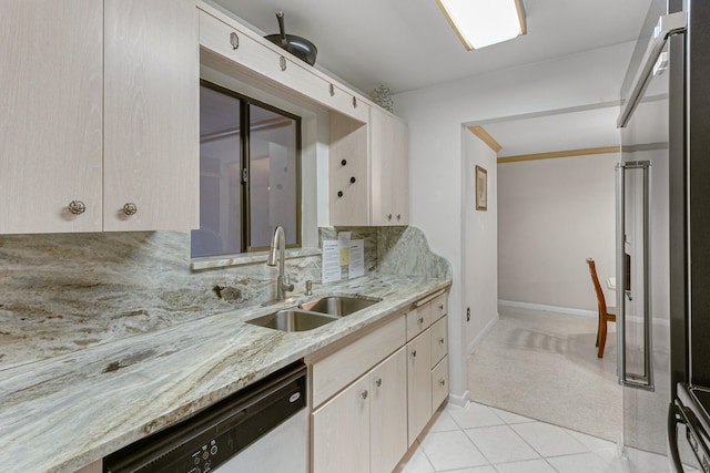 kitchen featuring high end fridge, dishwasher, light stone countertops, light colored carpet, and sink