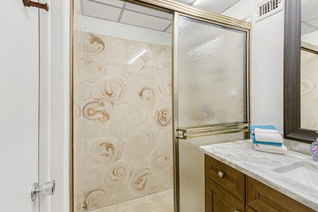 bathroom with a shower with shower door and oversized vanity