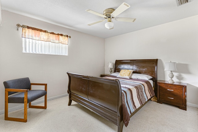 bedroom featuring light carpet and ceiling fan