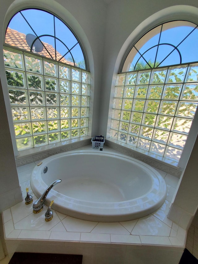 bathroom featuring tiled bath