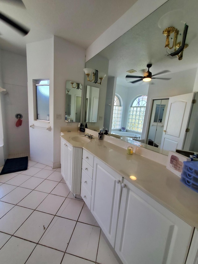 bathroom featuring tile patterned floors, ceiling fan, and vanity