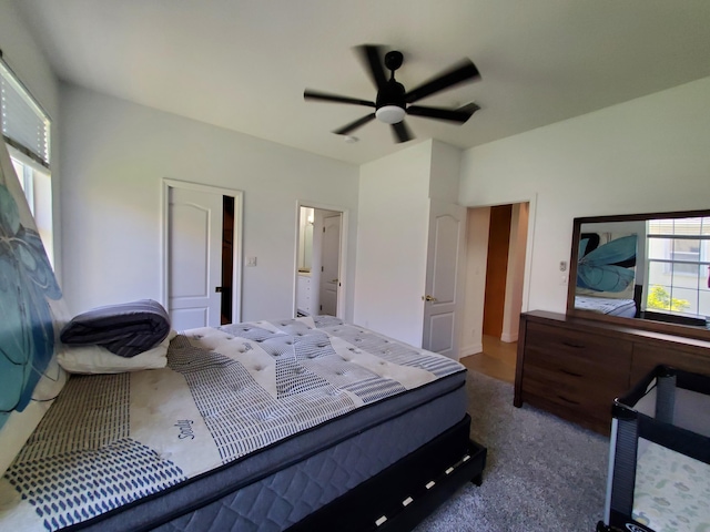 bedroom with dark colored carpet and ceiling fan