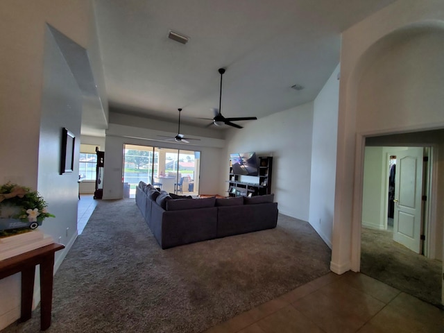 living room with carpet and ceiling fan