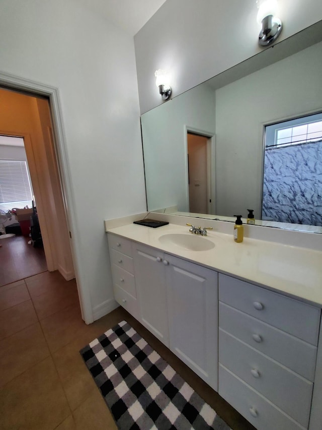 bathroom with tile patterned flooring and vanity