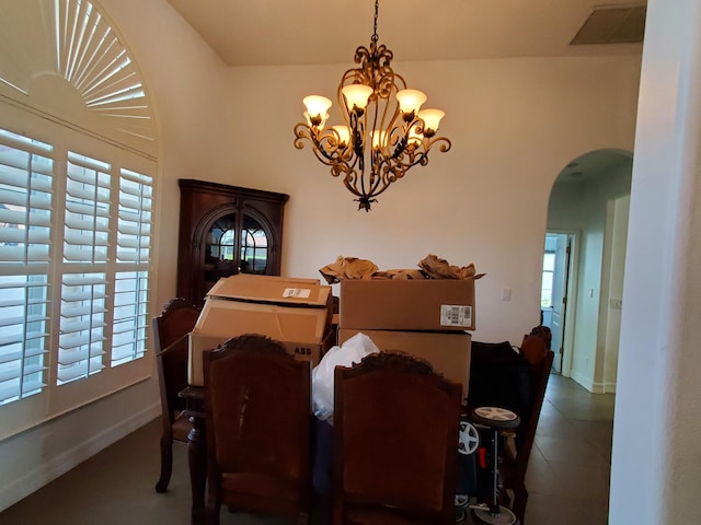 dining area featuring plenty of natural light and a chandelier