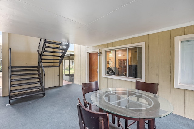 dining space with wooden walls