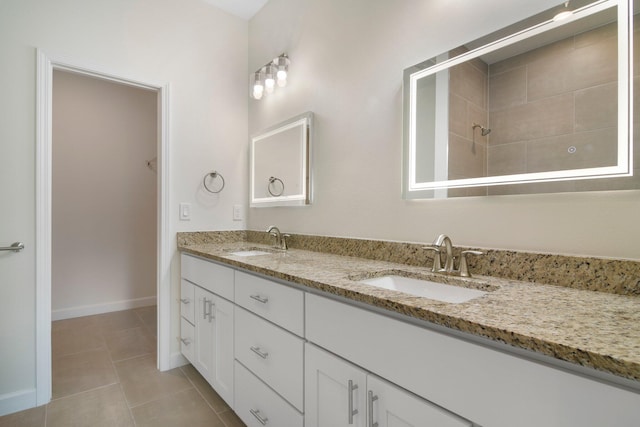 bathroom featuring double vanity and tile flooring