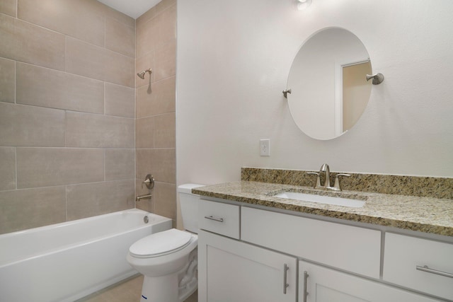 full bathroom featuring vanity, toilet, and tiled shower / bath combo