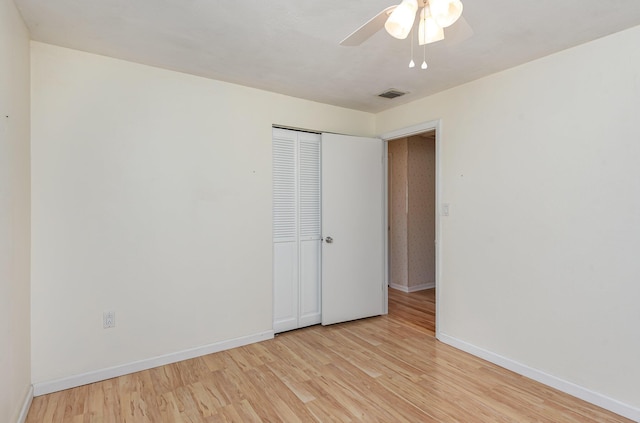 unfurnished room featuring light hardwood / wood-style flooring and ceiling fan