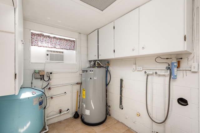 utility room with electric water heater