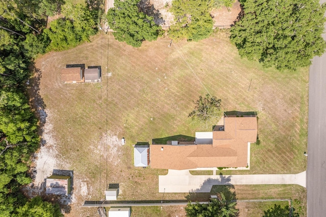 birds eye view of property with a rural view