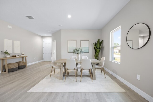 dining space featuring light wood-type flooring