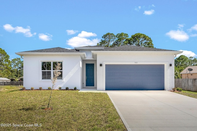 view of front of property featuring a garage and a front yard