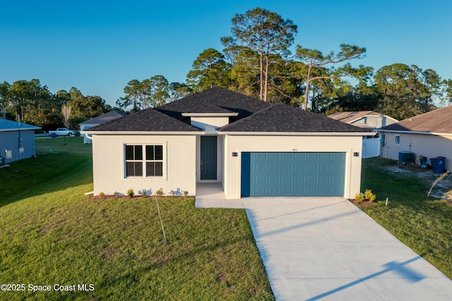 view of front of home with central AC unit, a garage, and a front yard