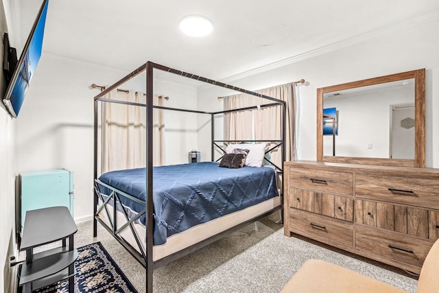 bedroom featuring light carpet and crown molding