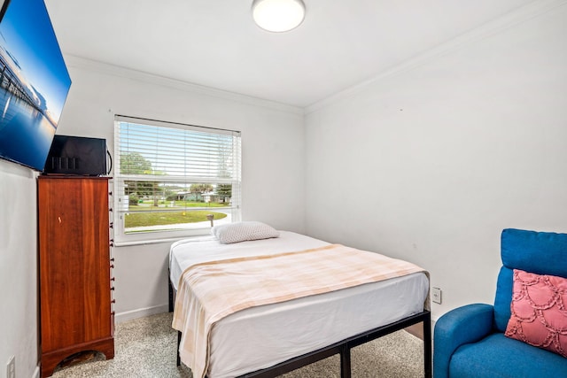 carpeted bedroom featuring crown molding