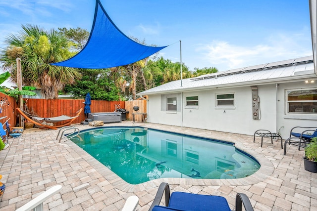 view of pool with a patio area and a jacuzzi