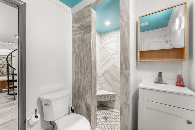 bathroom featuring walk in shower, crown molding, toilet, vanity, and hardwood / wood-style flooring