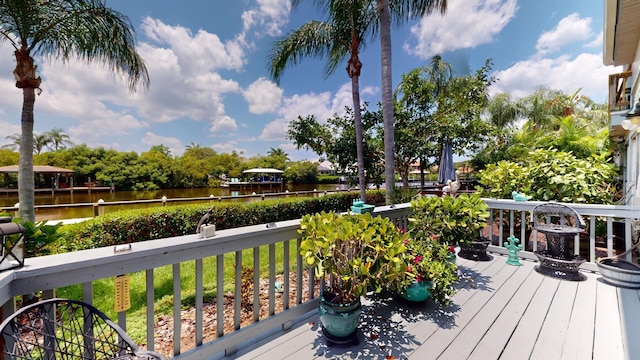 wooden terrace with a water view