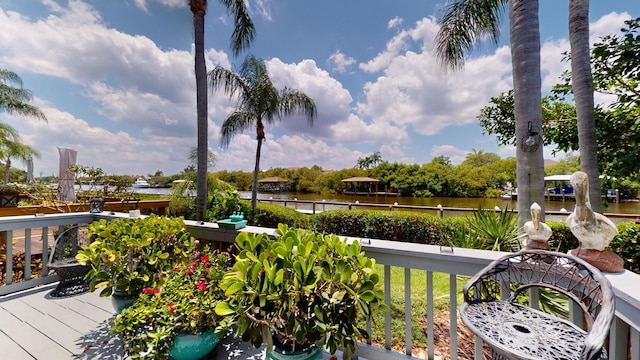 wooden terrace with a water view