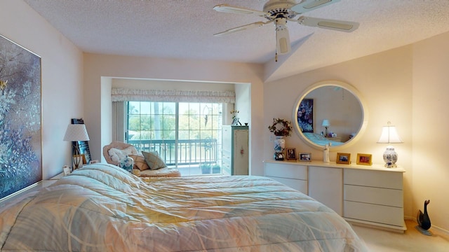 carpeted bedroom featuring access to outside, ceiling fan, and a textured ceiling