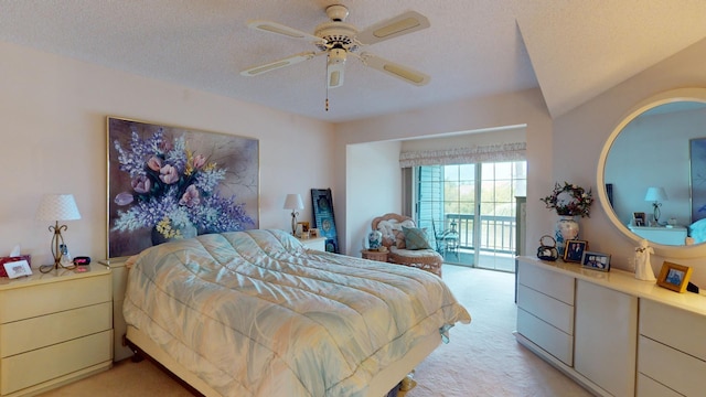 carpeted bedroom featuring ceiling fan, a textured ceiling, and access to outside